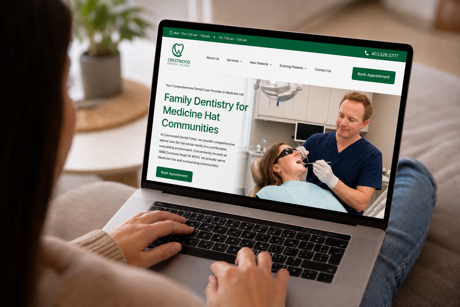 Person browsing the new Crestwood Dental Clinic homepage on a laptop