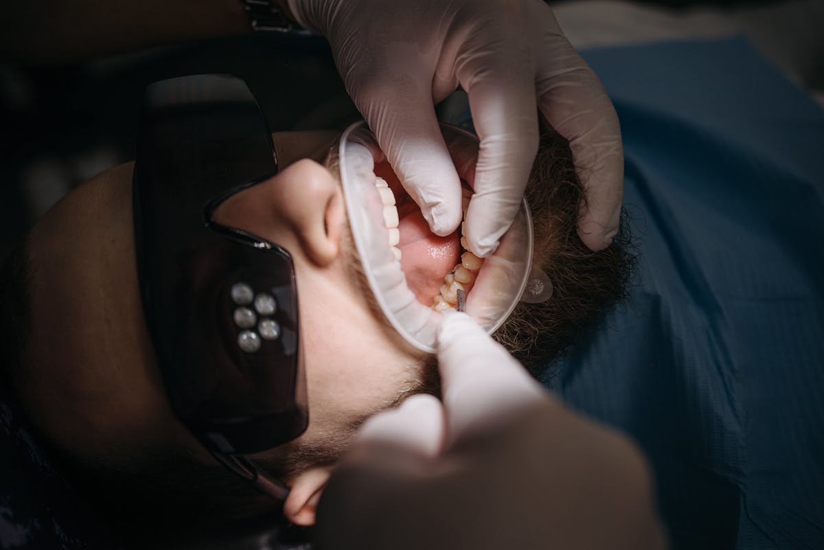Dentist performing a jaw exam on a patient