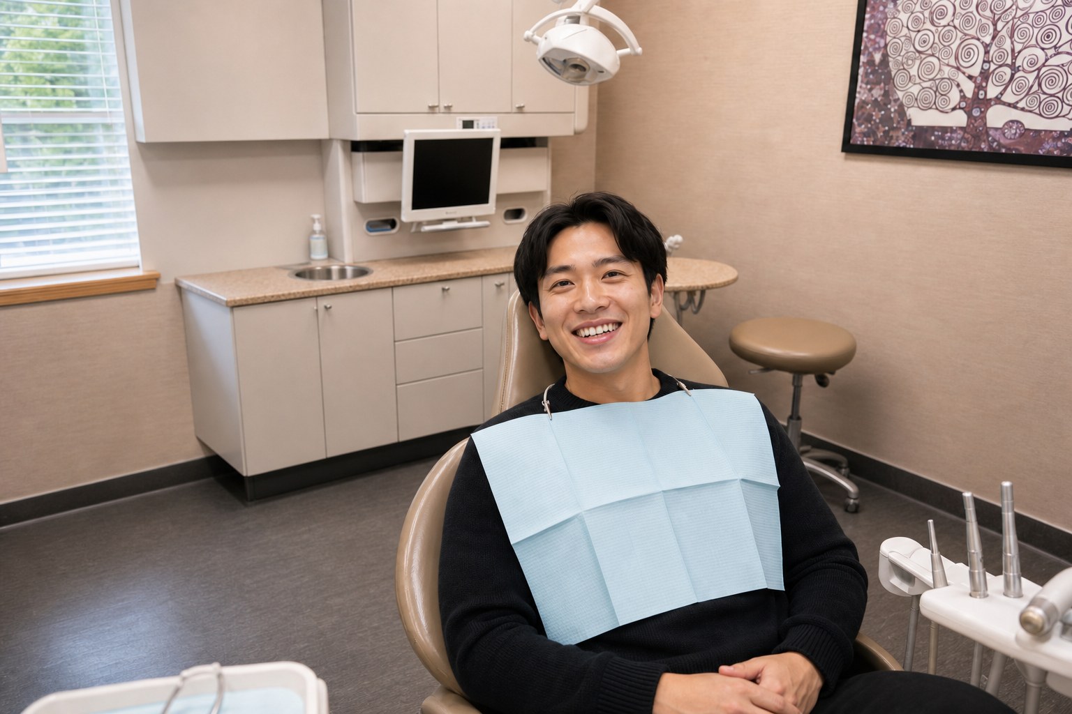 Patient smiling after knocked-out tooth repair at Crestwood Dental Clinic