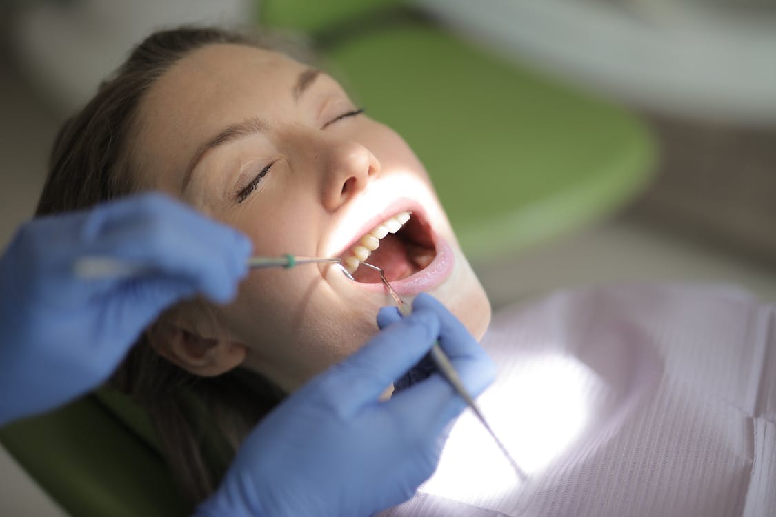 Dental exam assessing gum and tooth health